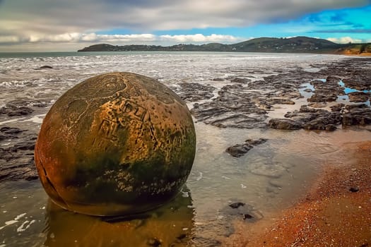 Moeraki boulder on the beach during low tide, Moeraki, New Zealand