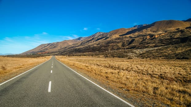 Beautiful paved road towards New Zealand Alps