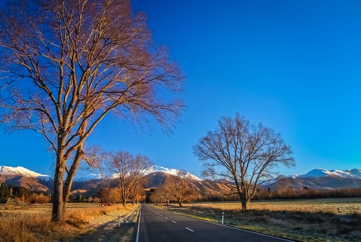 Road through the beautiful mountain scenery on the road to Mt Cook in New Zealand