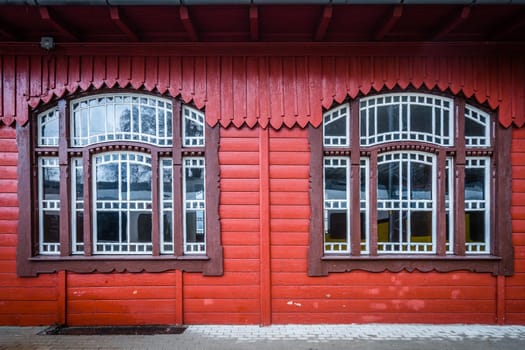 Windows and wooden building facade of the old train station building in Szklarska Poreba, Poland