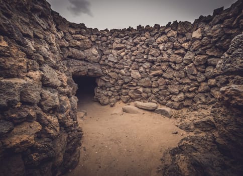 Old home entrance in an archaeological site of an old aboriginal village in Fuerteventura, Canary Islands, Spain