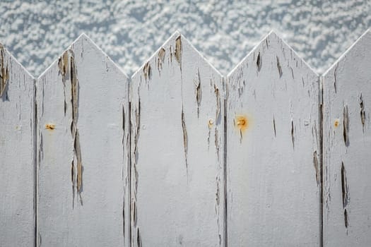 Close up of an old withered white fence