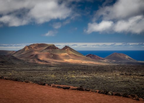 Volcanic landscape of the Timanfaya National Park ( also called The Montanas del Fuego or Mountains of Fire ) in Lanzarote, Canary Islands, Spain