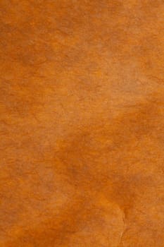 Dark yellow background of an old cardboard paper