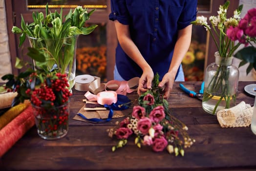 Florist making rose bouquet