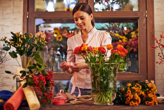 Flower girl working with flowers
