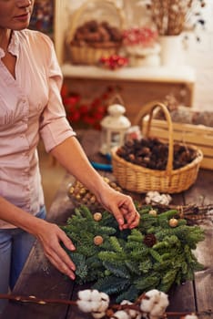 Woman making Christmas wreath