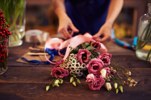 Female hands making a bouquet