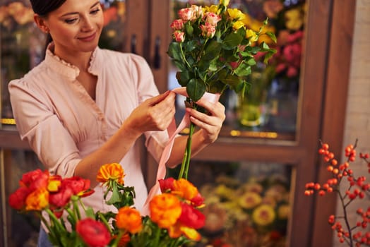 Young woman working at flower shop
