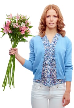 Cute female with bunch of pink lilies looking at camera