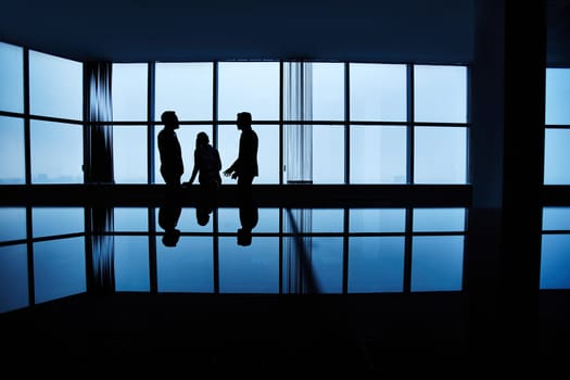 Three people meeting late in office