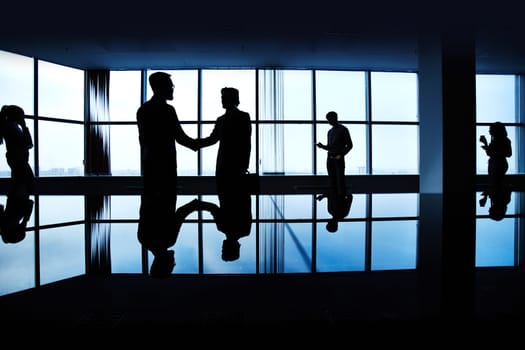Silhouettes of people in the dark
