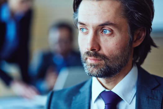 Close-up of face of manager looking away