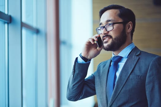 Portrait of businessman talking on the phone
