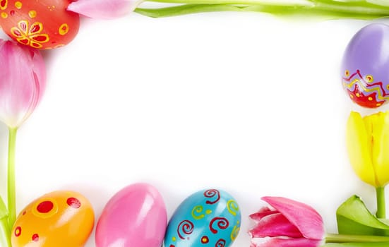 Frame made of fresh tulips and painted eggs