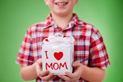 Present for mother with note held by little lad