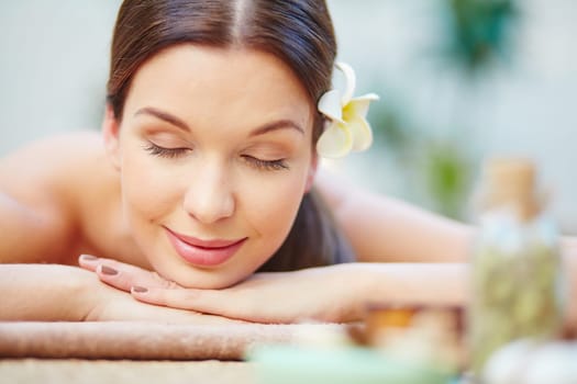 Serene girl relaxing and enjoying day spa