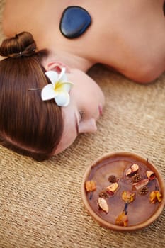 Young girl having relaxing massage in spa salon
