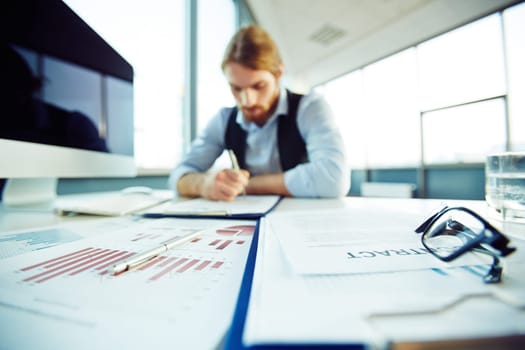 Office worker busy working with papers