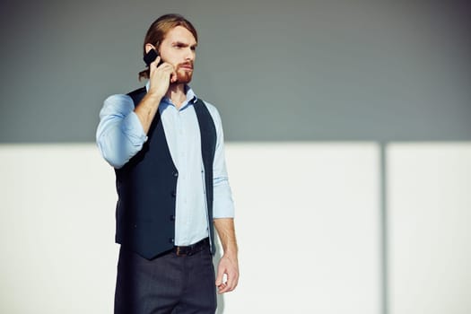 Serious man talking on the phone