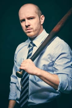 Determined businessman with a bat