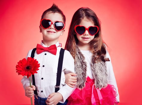 Portrait of well-dressed children in sunglasses