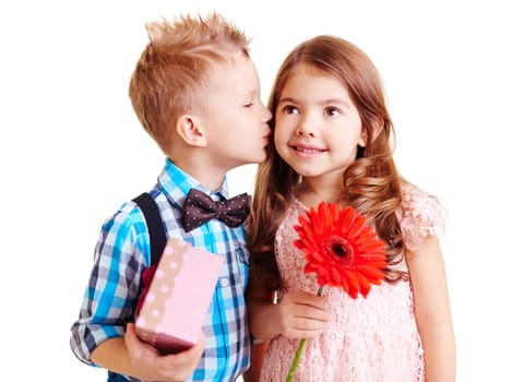 Little boy kissing hi girlfriend