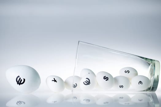 Conceptual image of eggs with currency