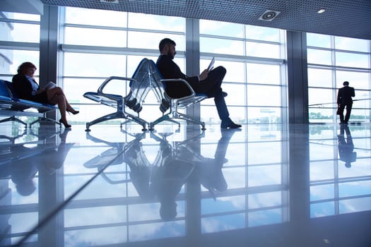 Waiting room with passengers in the airport
