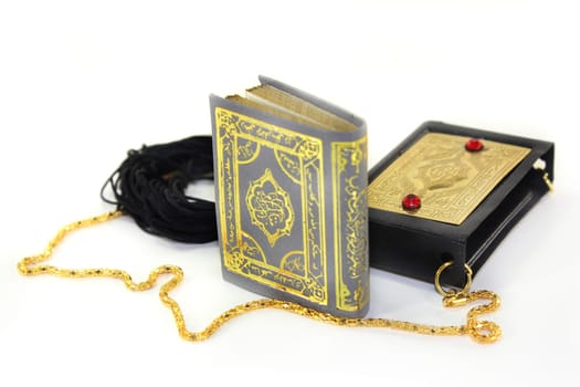 a Koran with a cover and chain