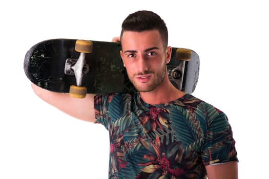 Handsome young man holding skateboard on his shoulder, isolated on white