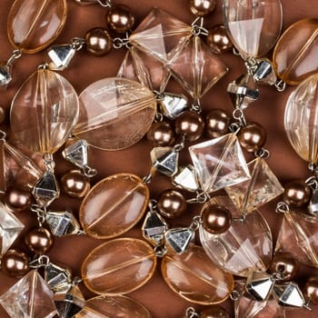 Transparent brown jewel texture on brown background.
