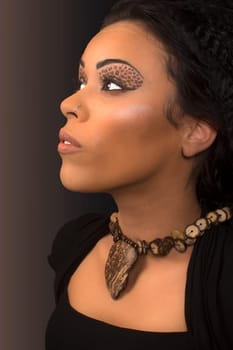 Beauty portrait of beautiful black woman on the gray background.