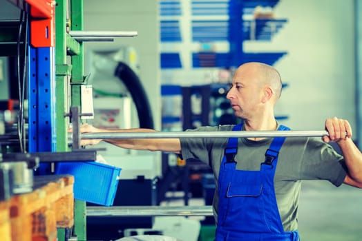 one worker in factory in stockroom