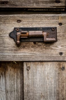 Old rusted lock on a shed in the garden