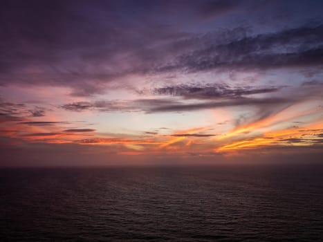 Sunset over the ocean on the coast of Sao Miguel Island in the Azores, Portugal