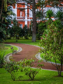 Empty bench in the Municipal botanical gardens in Ponta Delgada, the capital of Sao Miguel island, Azores, Portugal