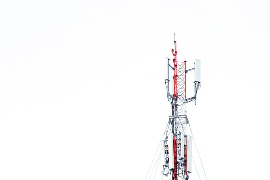 Mobile phone communication tower transmission  signal with blue sky background and antenna