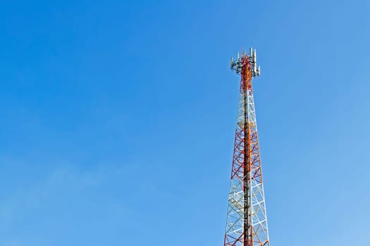 Mobile phone communication tower transmission  signal with blue sky background and antenna