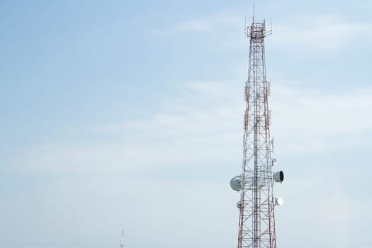 Mobile phone communication tower transmission  signal with blue sky background and antenna