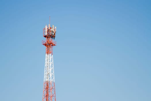 Mobile phone communication tower transmission  signal with blue sky background and antenna
