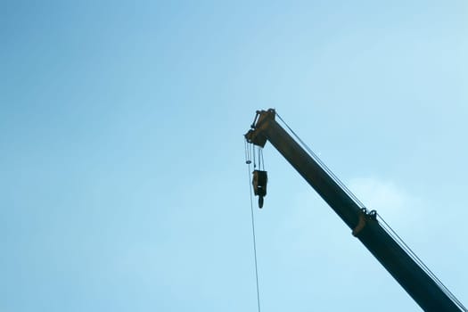 Industrial crane scale on blue sky background