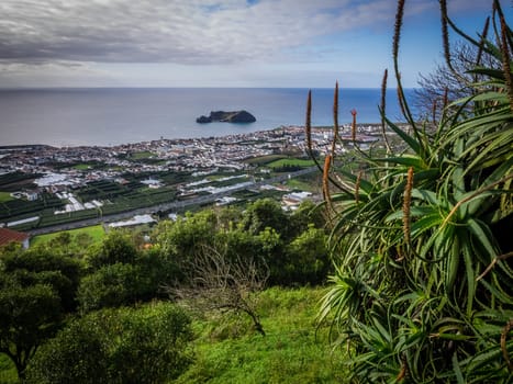 View of the small Ilheu da vila island which a popular summer retreat for people in Vila Franca do Campo in Sao Miguel Island in the Azores.