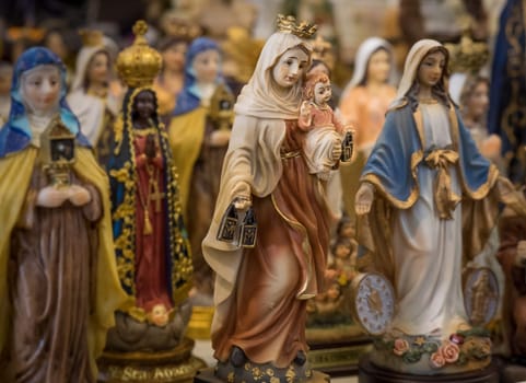 Small statuettes of saints on sale in a shop in Ponta Delgada, Sao Miguel Island, Azores, Portugal