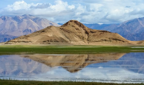 Rock reflected in a lake, beautiful landscape of Western Tibet