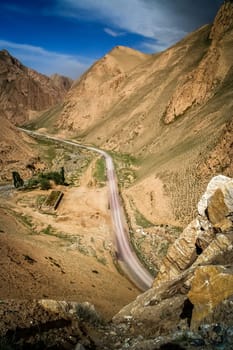 Twisting mountain road in Xinjang province in China leading to Western Tibet