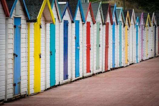 Row of colourful beach huts in Paignton, Devon, England