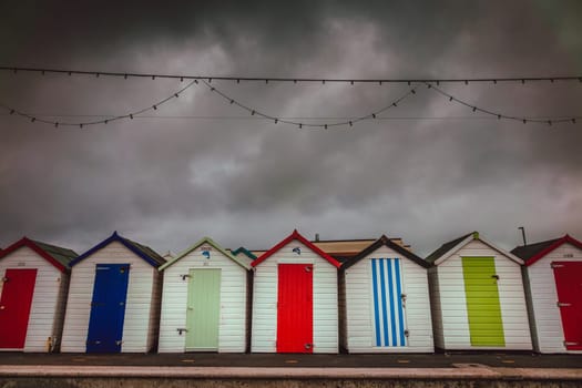 Row of colourful beach huts in Paignton, Devon, England