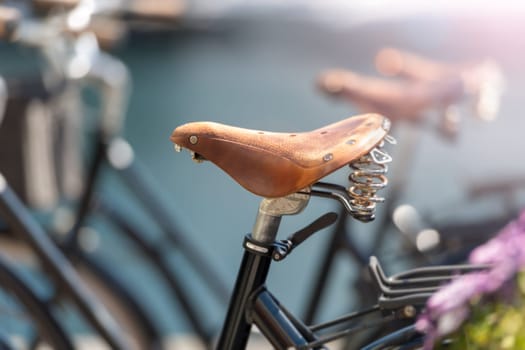 Bicycle saddle close up in street of Alesund, Norway, Scandinavia, Europe. Active lifestyle, city transportation.