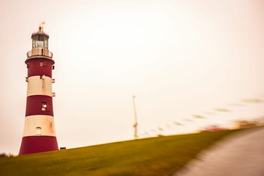 Lighthouse in Plymouth harbour on a rainy day, Devon, England